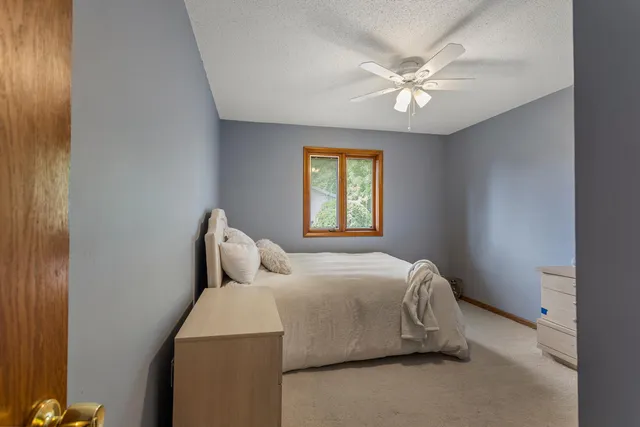 a bedroom with a bed and window