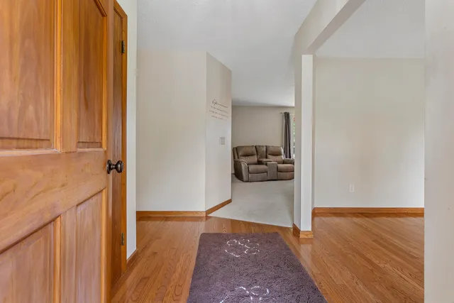 a view of a storage and utility room in wooden floor