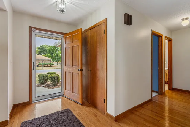 a view of entryway with wooden floor