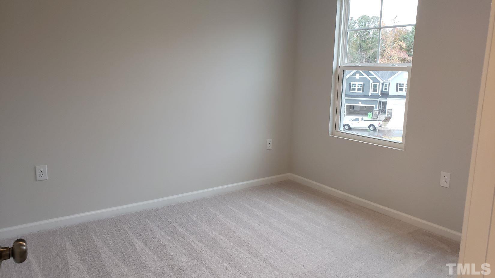 1833 Joscara Lane, Unit 1833 Apex, NC 27502 - Photo 15 of 37 an empty room with windows