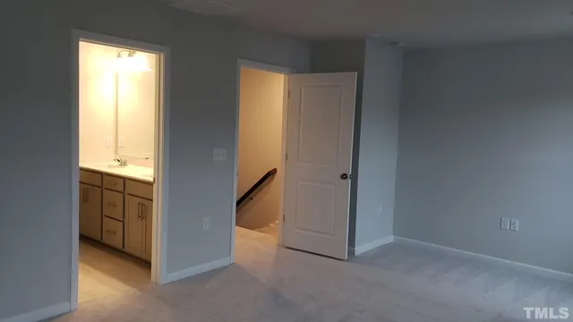a bathroom with a glass shower door