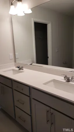 a bathroom with a glass shower door