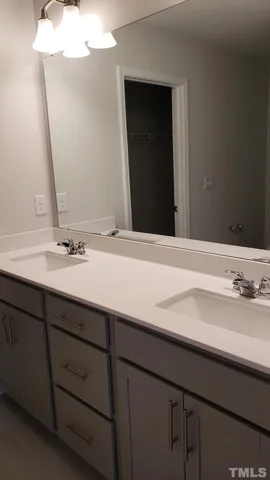 a bathroom with a glass shower door