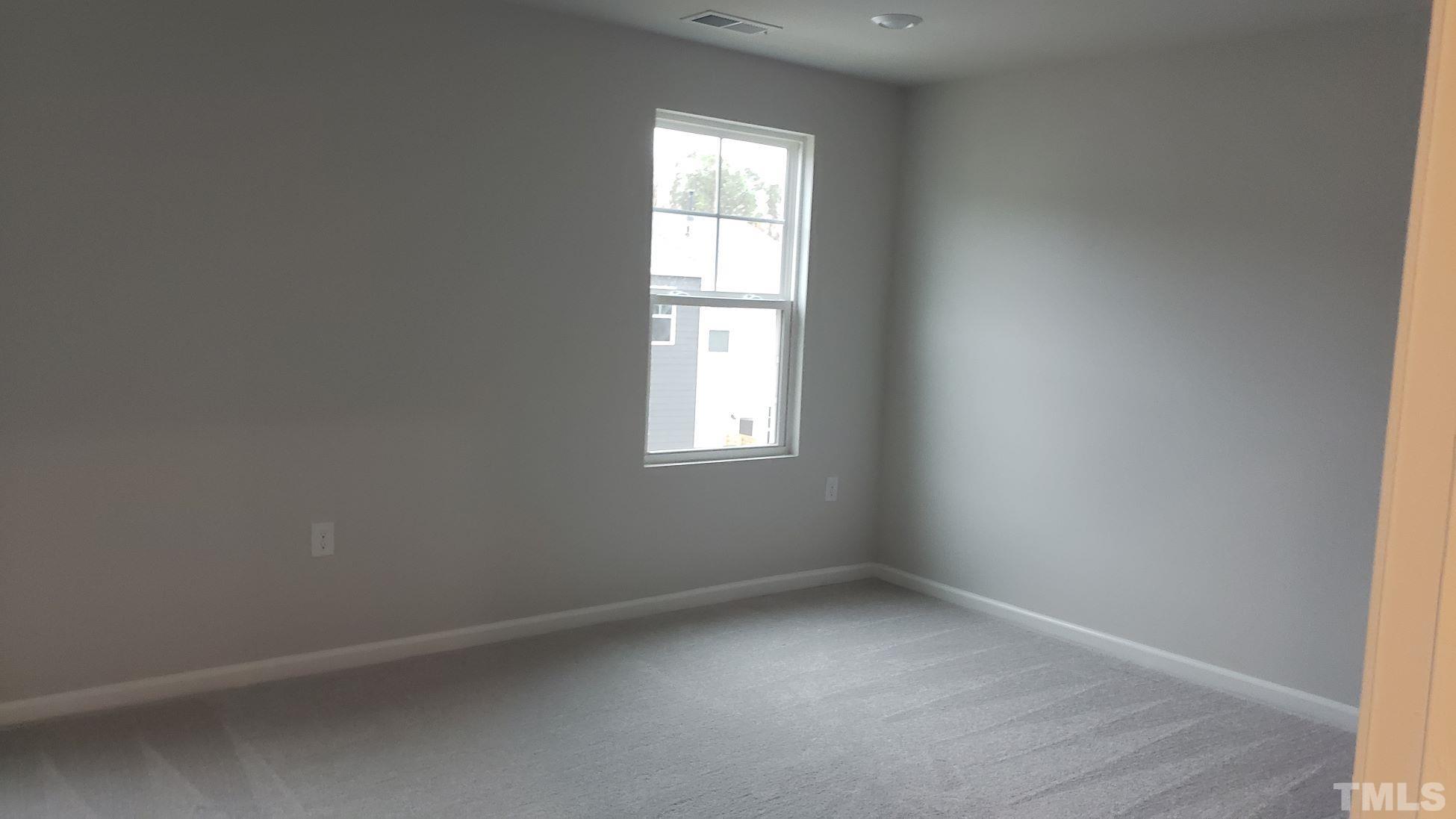 1833 Joscara Lane, Unit 1833 Apex, NC 27502 - Photo 21 of 37 an empty room with a window