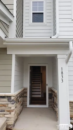 a kitchen with stainless steel appliances a refrigerator microwave and sink