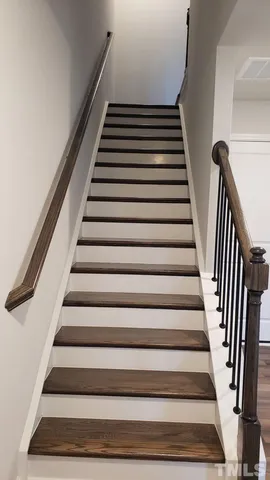 a kitchen with stainless steel appliances a stove microwave and sink