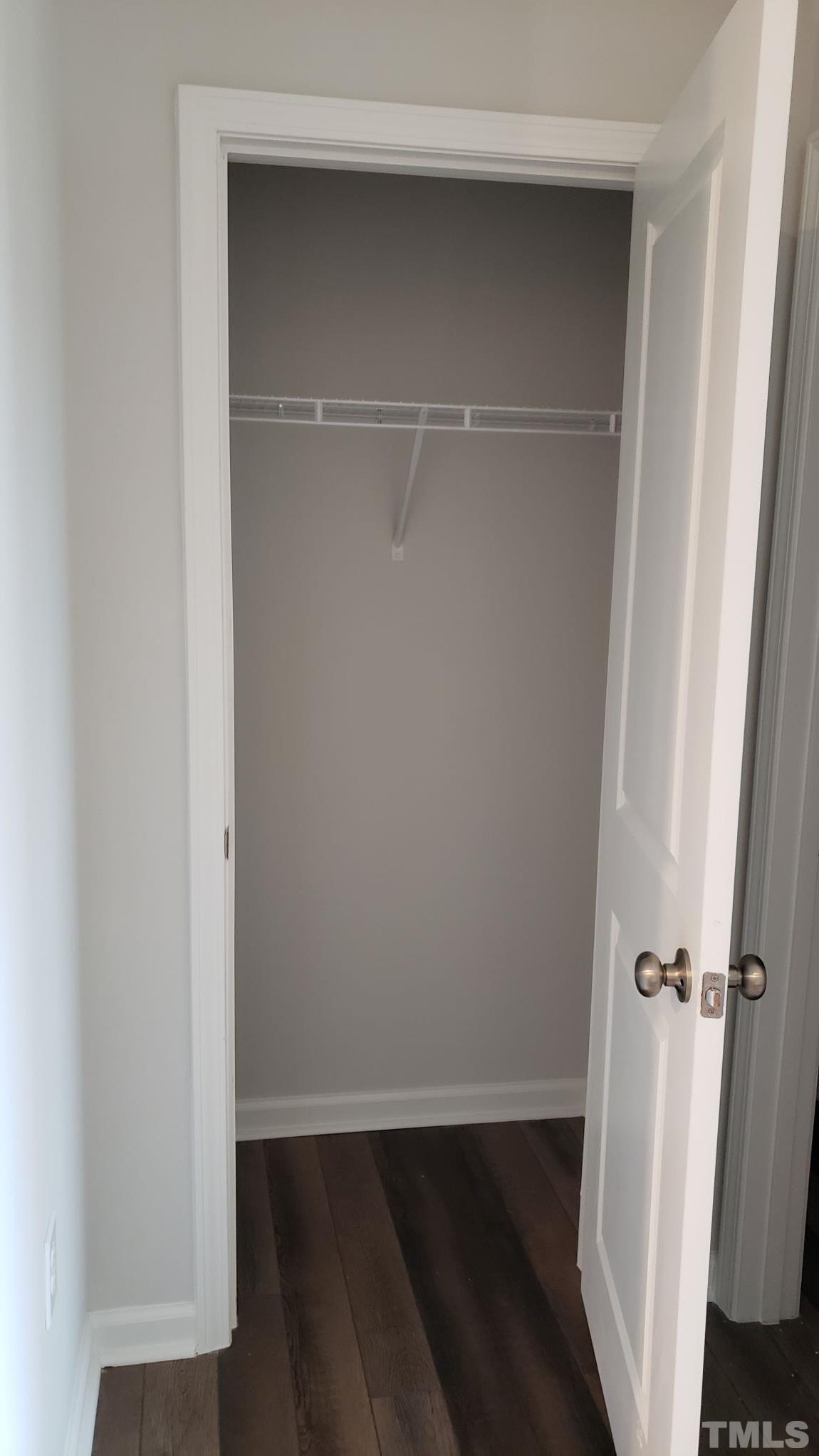 1833 Joscara Lane, Unit 1833 Apex, NC 27502 - Photo 7 of 37 a view of walk in closet with wooden floor