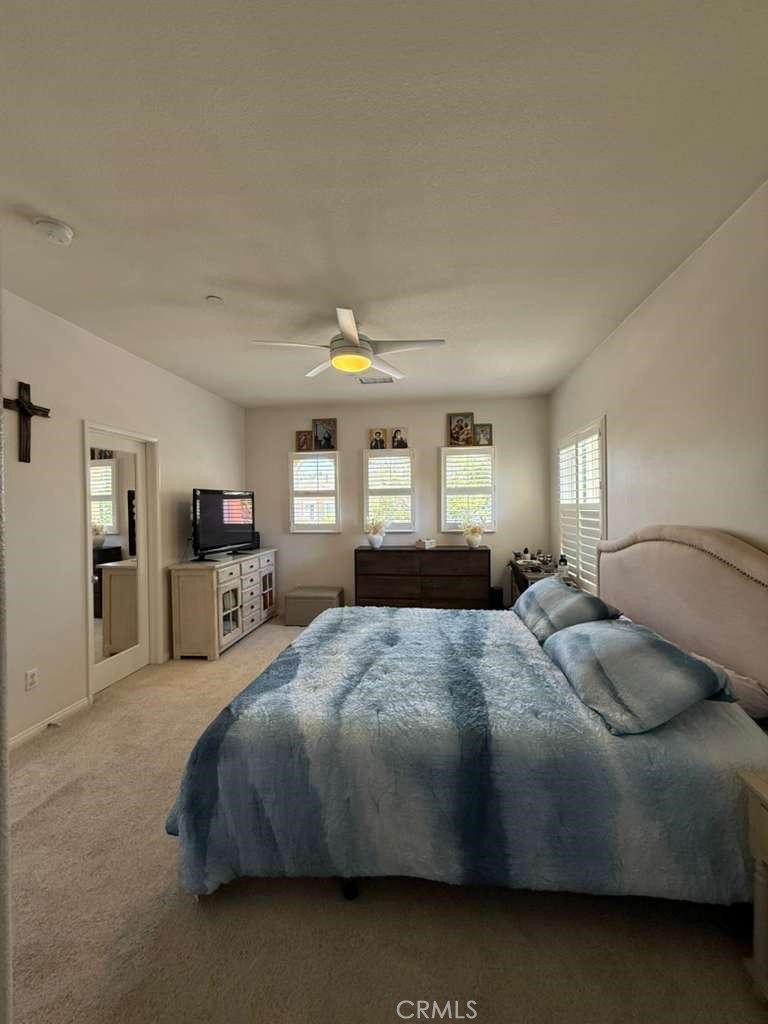2931 Esperanza Way, Unit B Simi Valley, CA 93063 - Photo 34 of 49 a bedroom with a bed and window
