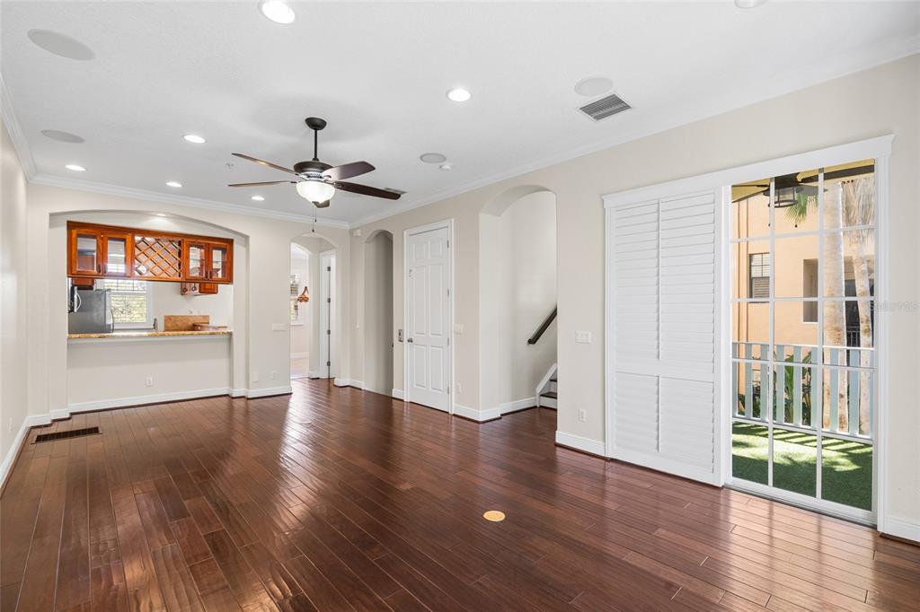 6002 Printery Street, Unit 105 Tampa, FL 33616 - Photo 12 of 64 wooden floor in an empty room with a window