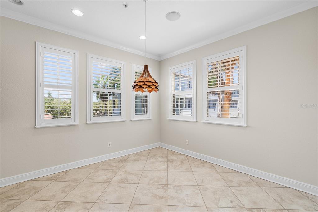 6002 Printery Street, Unit 105 Tampa, FL 33616 - Photo 18 of 64 an empty room with windows