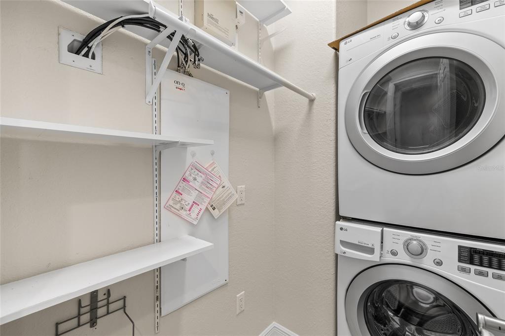 6002 Printery Street, Unit 105 Tampa, FL 33616 - Photo 20 of 64 a utility room with dryer and washer