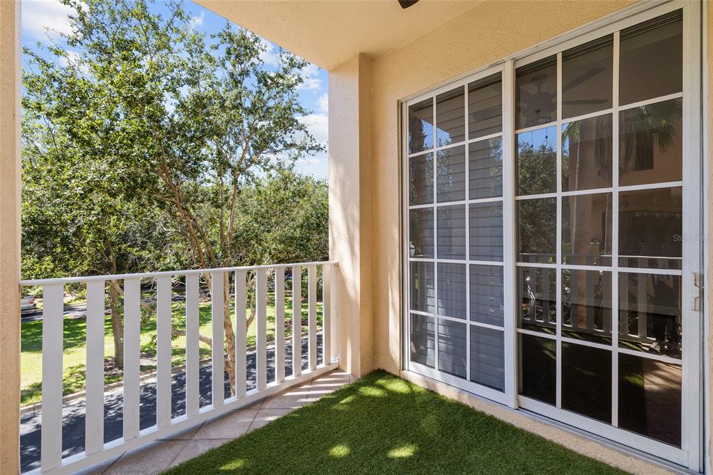 6002 Printery Street, Unit 105 Tampa, FL 33616 - Photo 32 of 64 a view of a deck with a large trees