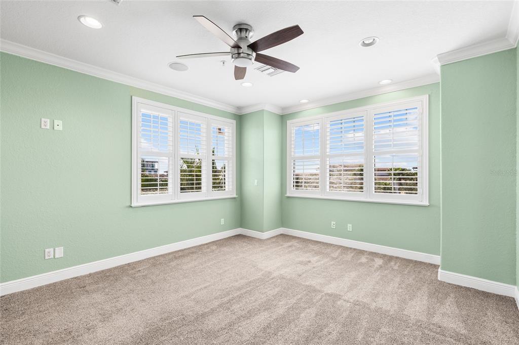 6002 Printery Street, Unit 105 Tampa, FL 33616 - Photo 35 of 64 a view of an empty room with a window and a ceiling fan