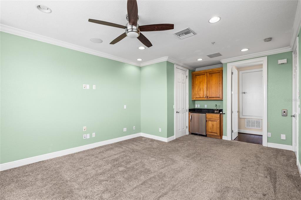6002 Printery Street, Unit 105 Tampa, FL 33616 - Photo 36 of 64 an empty room with closet and a ceiling fan