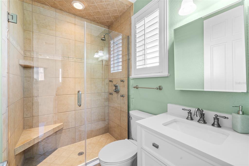 6002 Printery Street, Unit 105 Tampa, FL 33616 - Photo 38 of 64 a bathroom with a sink a toilet and shower