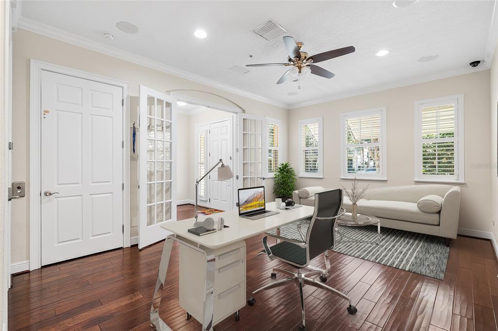 6002 Printery Street, Unit 105 Tampa, FL 33616 - Photo 5 of 64 a workspace with furniture and window