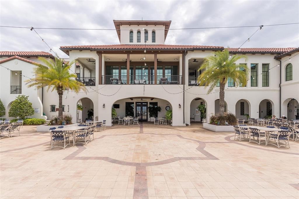 6002 Printery Street, Unit 105 Tampa, FL 33616 - Photo 59 of 64 a front view of a building with a lot of windows and plants