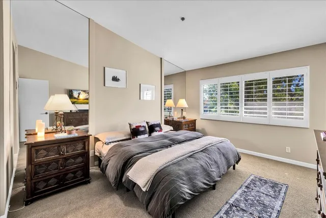 a bed room with a bed and a window