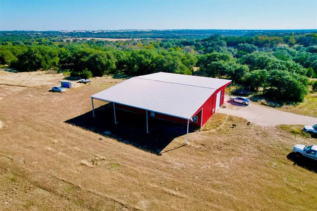 a view of a backyard with sitting area