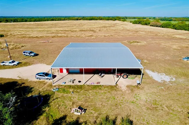 a view of a swimming pool with a yard