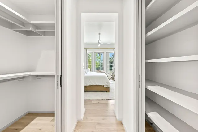 a view of bedroom with wooden floor