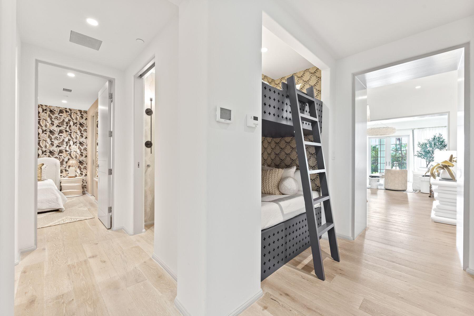 45 West Solaire Way Inlet Beach, Unit 103 Inlet Beach, FL 32461 - Photo 19 of 25 a view of a hallway and wooden floor and dining room