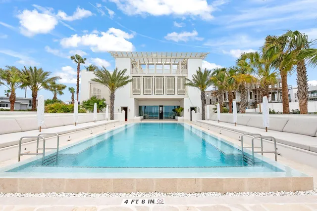 a view of a swimming pool with an outdoor seating