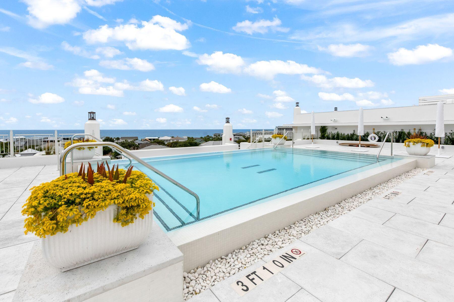 45 West Solaire Way Inlet Beach, Unit 103 Inlet Beach, FL 32461 - Photo 4 of 25 a view of a swimming pool with a lounge chair