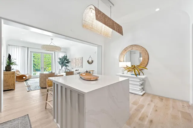 a view of a dining room with a table and chairs