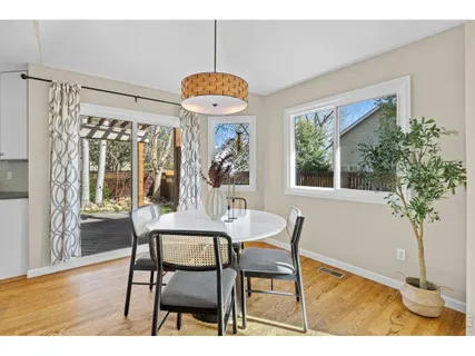 a view of a livingroom with furniture a fireplace and window