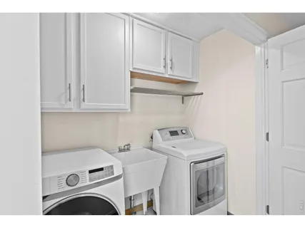 a kitchen with stainless steel appliances granite countertop a stove and a refrigerator