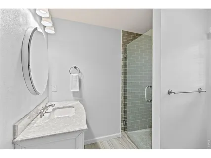 a kitchen with a sink a window and cabinets