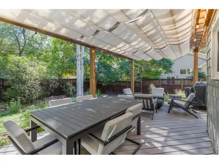 a view of a patio with chairs and backyard