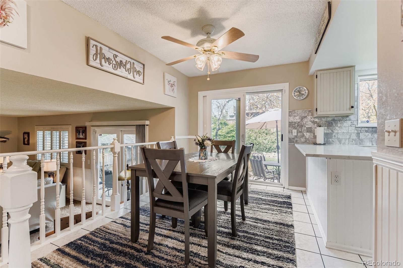 1055 Northridge Road Highlands Ranch, CO 80126 - Photo 11 of 32 a view of a dining room with furniture
