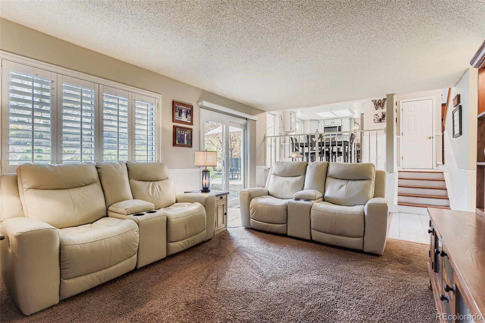 1055 Northridge Road Highlands Ranch, CO 80126 - Photo 13 of 32 a living room with furniture and a window
