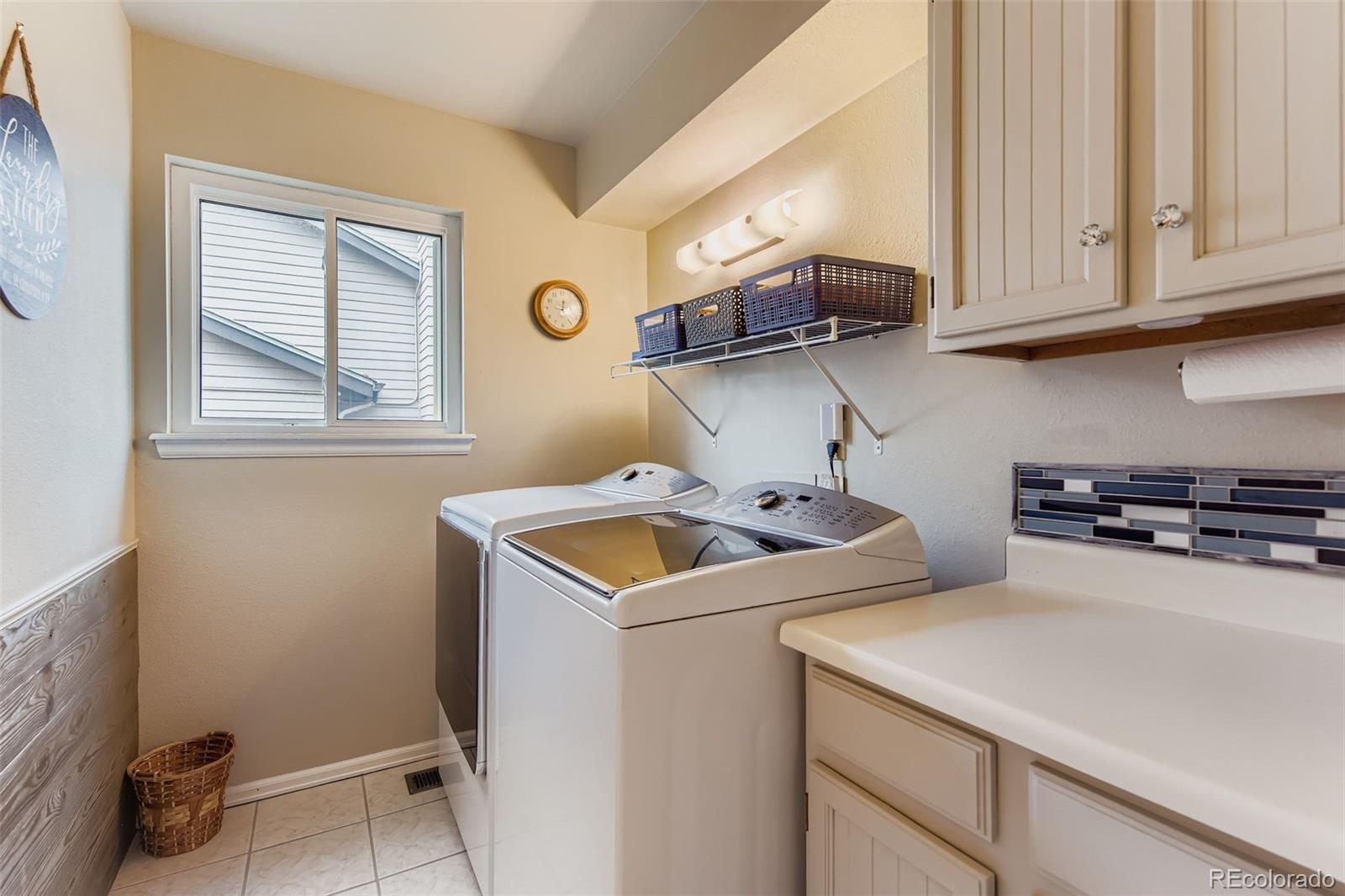 1055 Northridge Road Highlands Ranch, CO 80126 - Photo 24 of 32 a utility room with dryer and washer