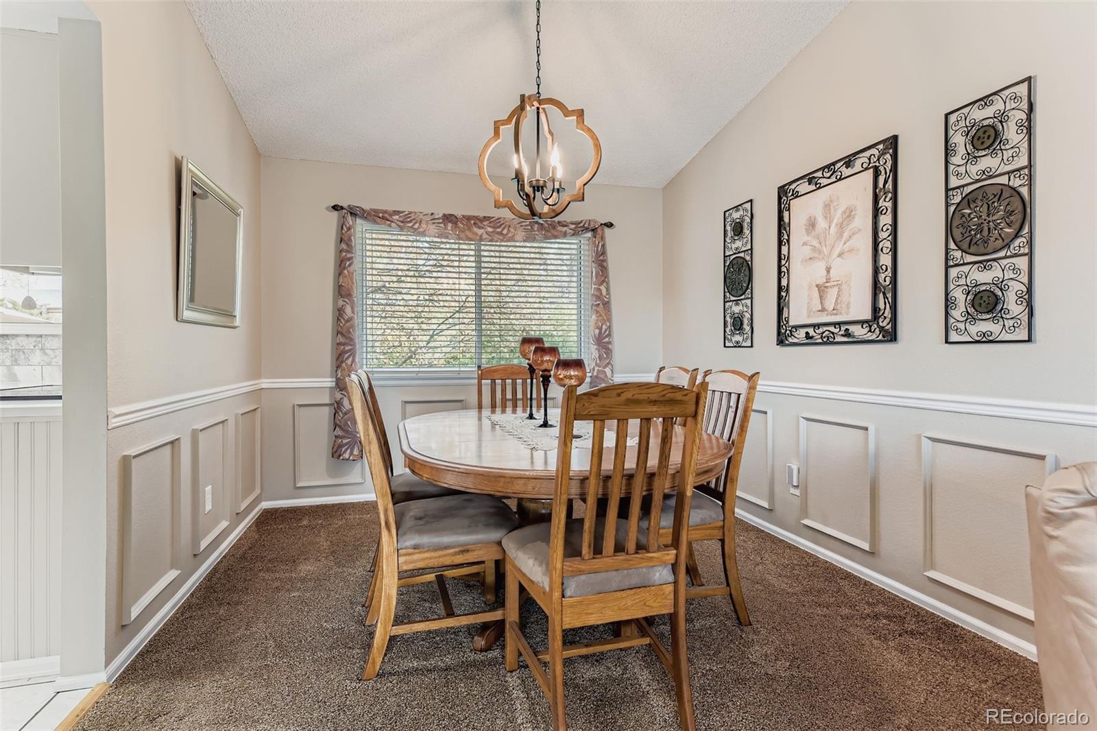 1055 Northridge Road Highlands Ranch, CO 80126 - Photo 7 of 32 a view of a dining room with furniture window and wooden floor