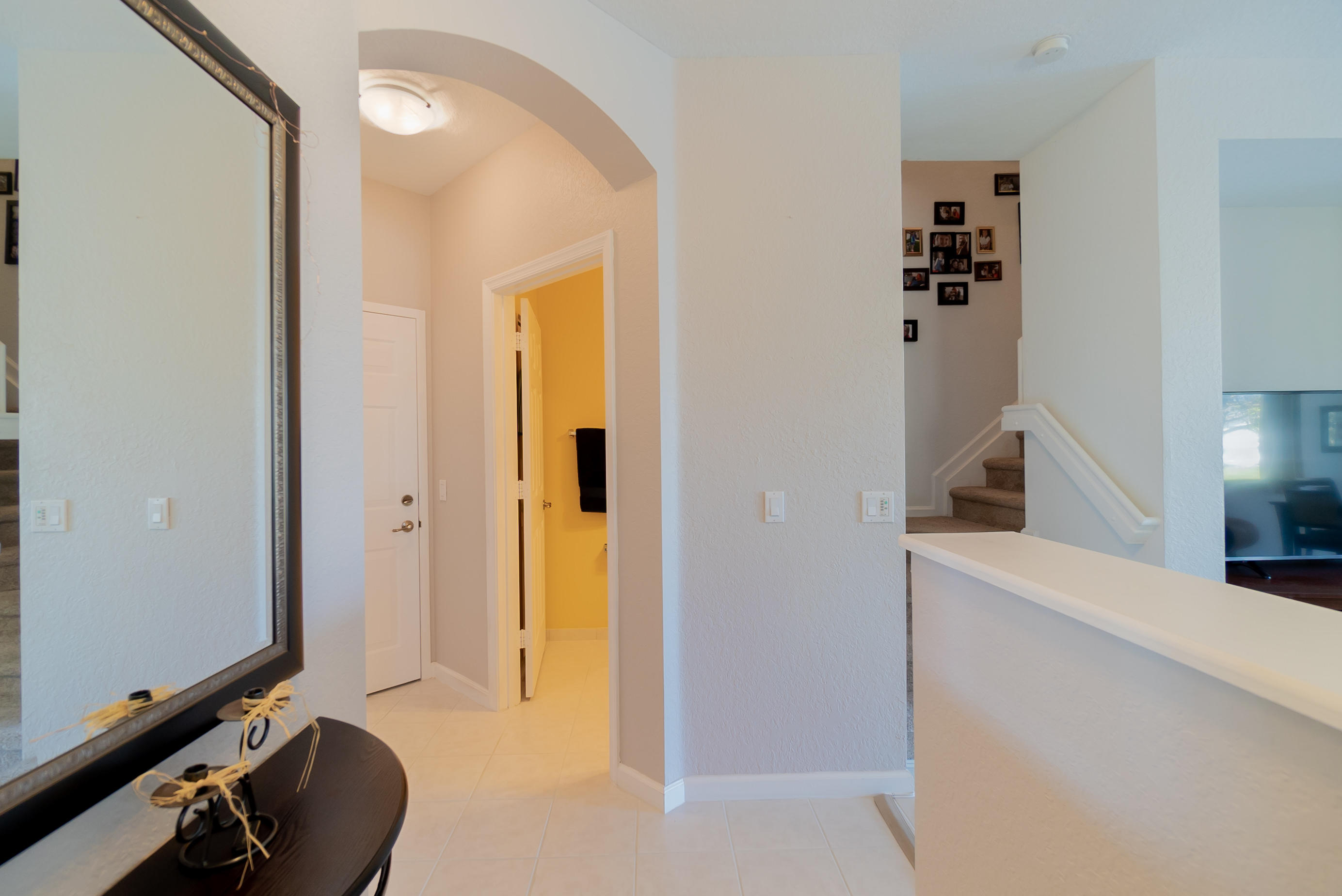 3170 Laurel Ridge Circle Riviera Beach, FL 33404 - Photo 3 of 27 a view of a hallway with workspace and a window