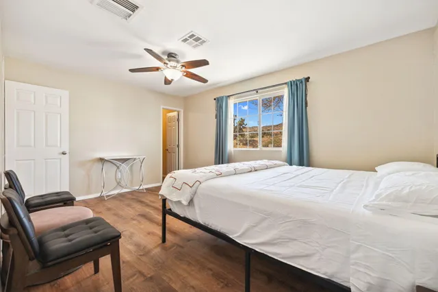a view of a refrigerator in kitchen and wooden floor
