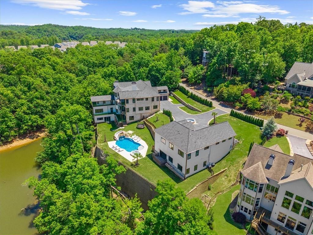 494 River Overlook Road Dawsonville, GA 30534 - Photo 72 of 96 an aerial view of a house with a garden and lake view