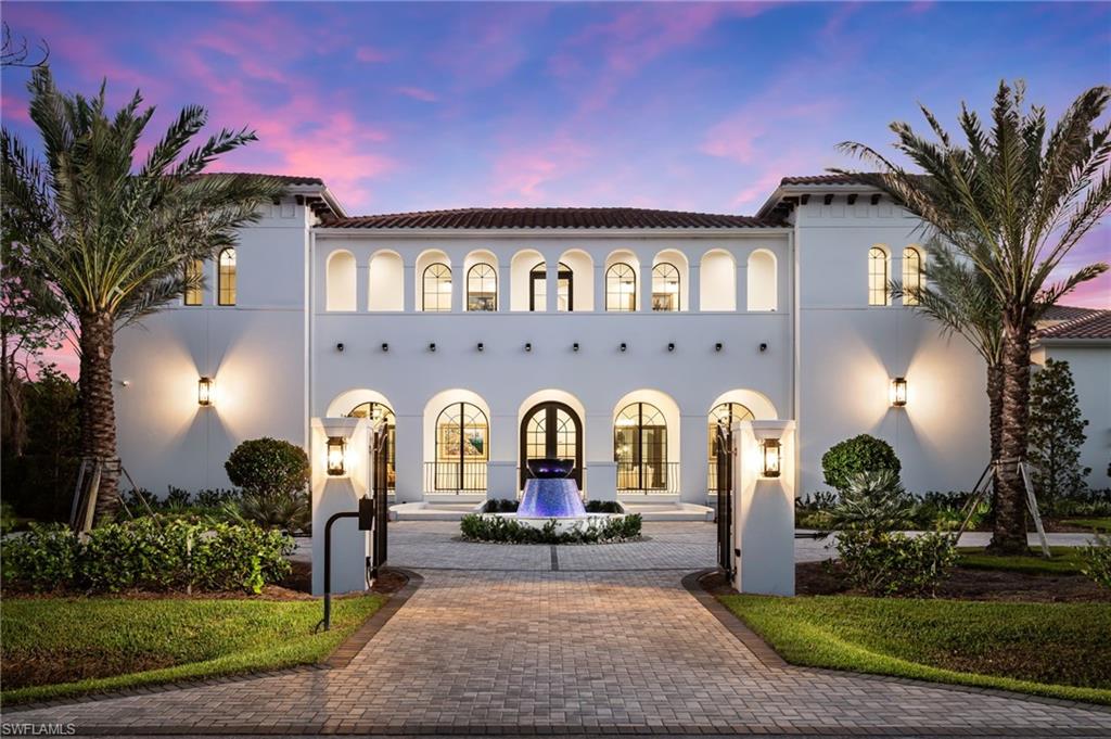 Undisclosed Address Naples, FL 34108 - Photo 1 of 16 a front view of a house with garden