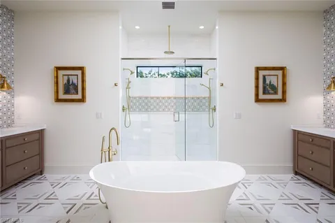 a bathroom with a bathtub and a sink