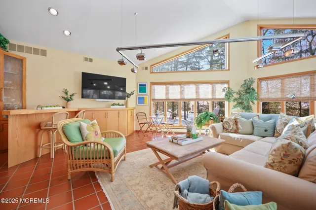 a view of a dining room with furniture and window