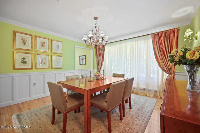 a living room with furniture workspace and a flat screen tv