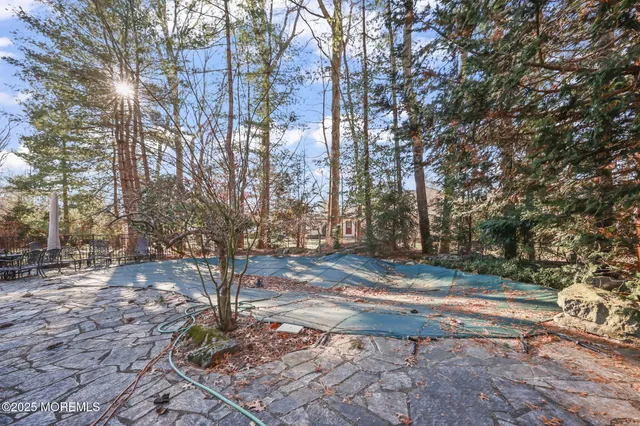 a bedroom with a large bed and a couch