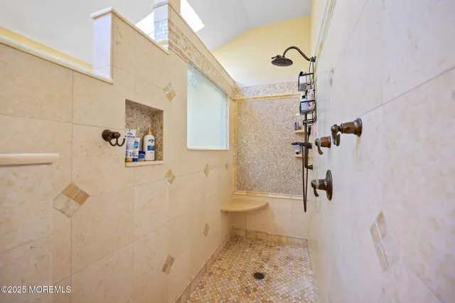 a living room with furniture a ceiling fan and window