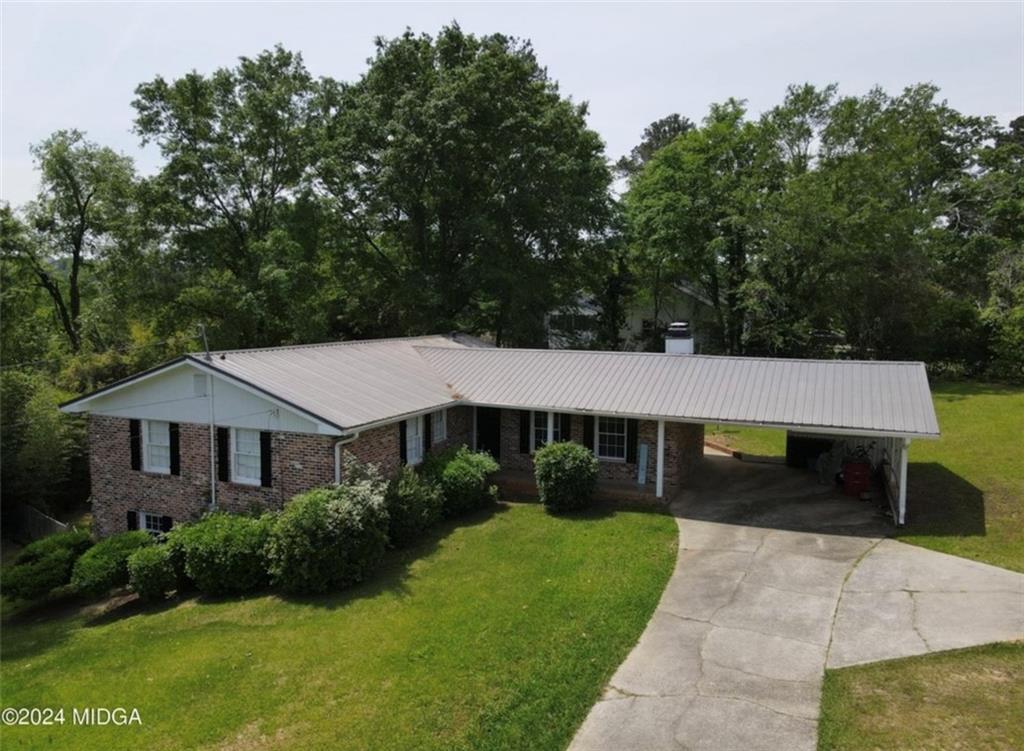 2960 Stuart Drive Macon, GA 31204 - Photo 1 of 10 a front view of a house with a yard