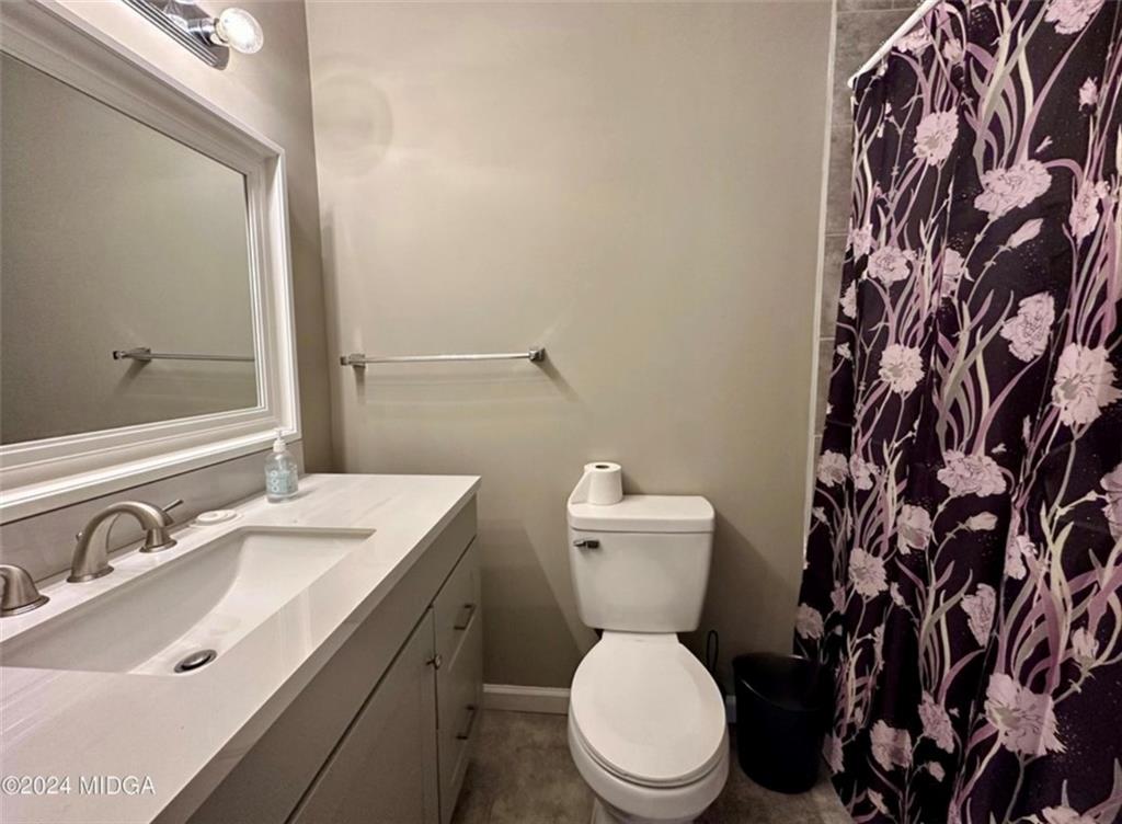 2960 Stuart Drive Macon, GA 31204 - Photo 9 of 10 a bathroom with a sink and a toilet