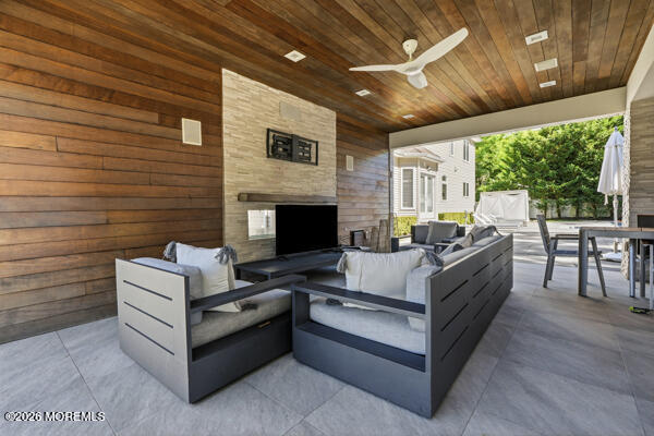 54 Georgetown Road Eatontown, NJ 07724 - Photo 21 of 24 a outdoor space with patio furniture and a fireplace