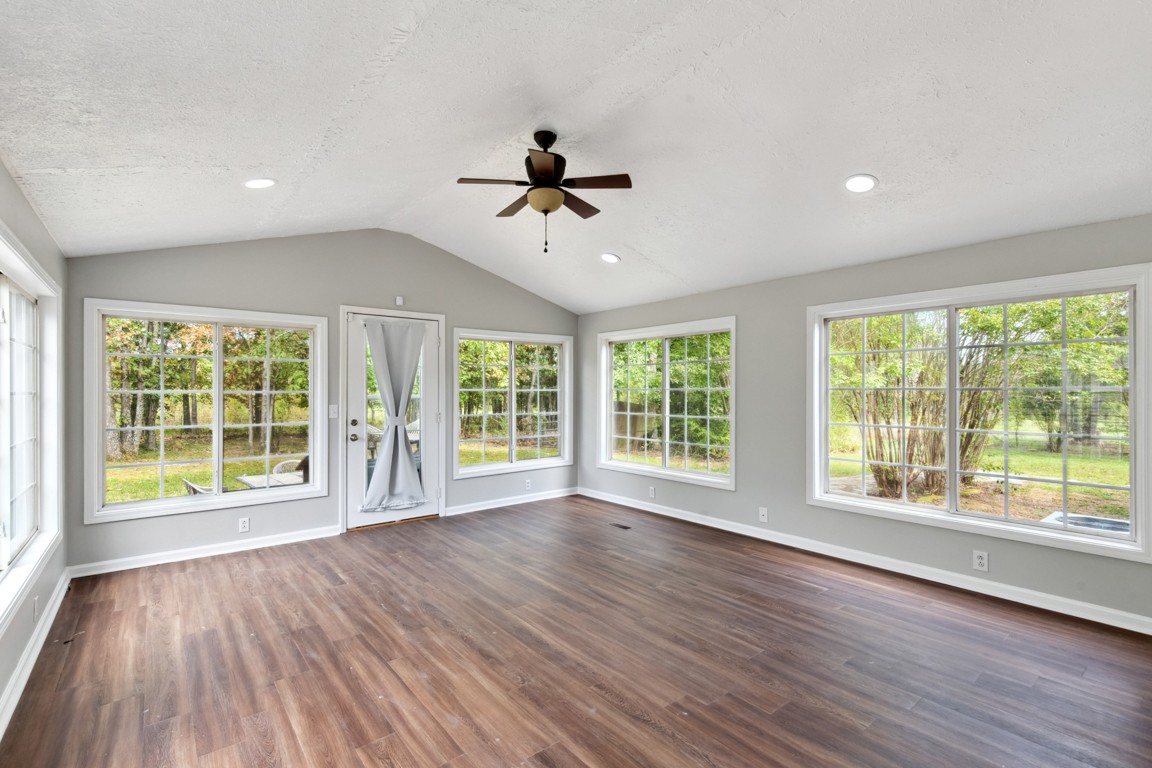 11201 New Zion Road Christiana, TN 37037 - Photo 11 of 19 a view of an empty room with wooden floor and a window